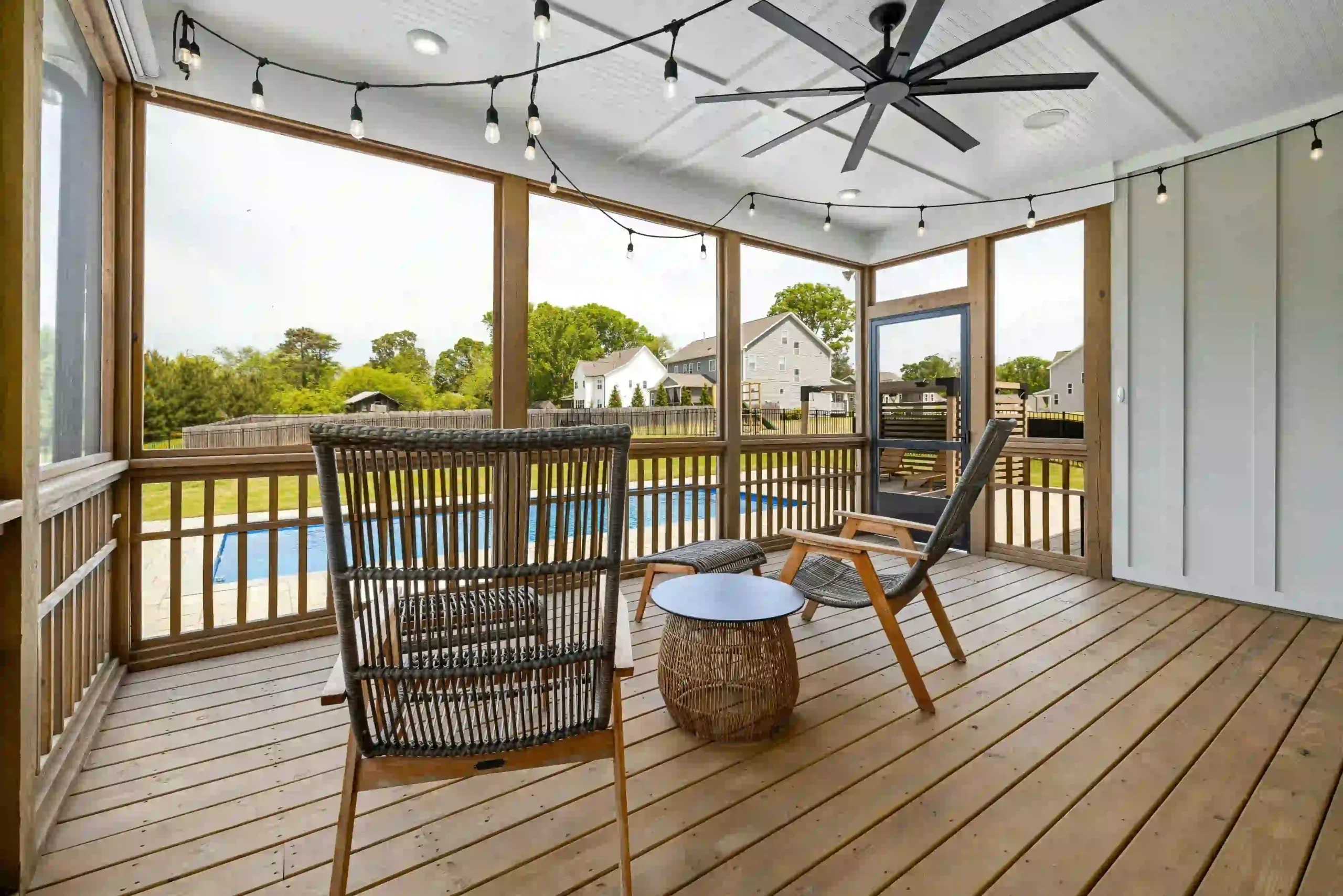 Modern pool deck installation with slip-resistant surface surrounding a residential swimming pool