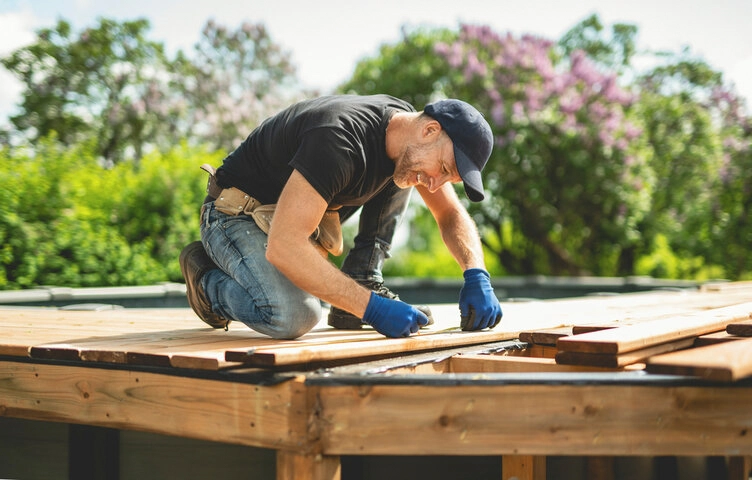 Deck contractors repairing structural framing and upgrading an outdoor deck in Sacramento